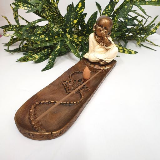 Long incense holder featuring a serene monk design, perfect for enhancing meditation and aromatherapy experiences.