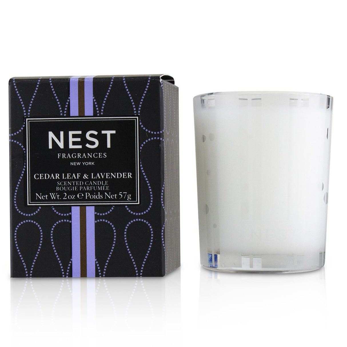 Scented candle featuring cedar leaf and lavender, creating a calming ambience for up to 20 hours. Perfect for relaxation.