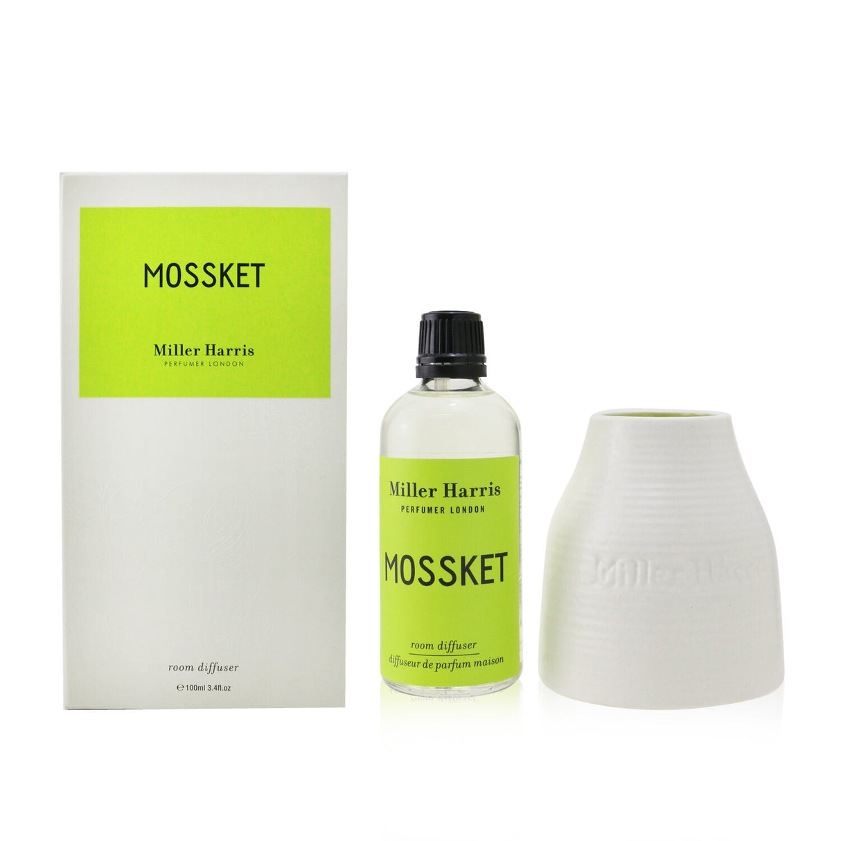 Elegant Miller Harris diffuser in artisan ceramic pot with natural wood reeds, delivering sensual Mossket fragrance for your home.