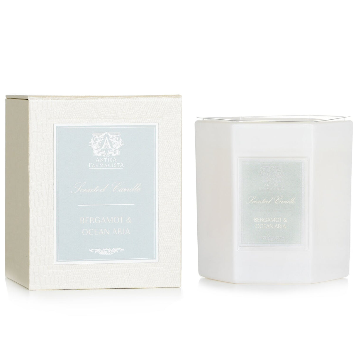 Luxurious hexagonal candle in a soft white glass, featuring oceanic and citrus scents; perfect for home decor and gifting.