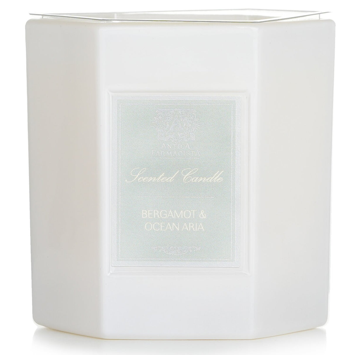 Elegant hexagonal candle in white glass, blending bergamot, ocean tones, and floral scents; 60-hour burn time.