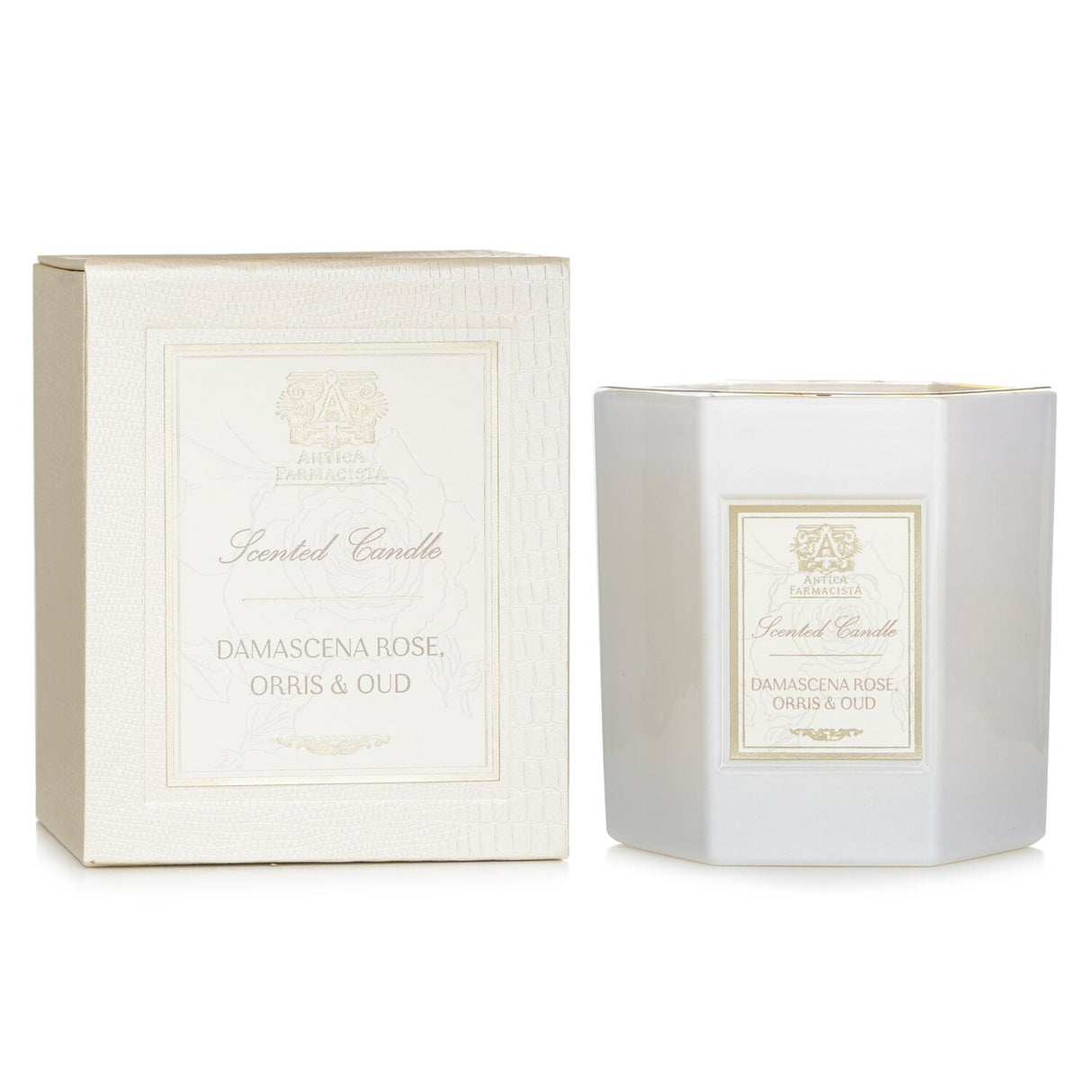 Luxurious hexagonal candle in soft white glass, featuring a floral blend of Damascena rose, orris, and oud for 60 hours of fragrance.