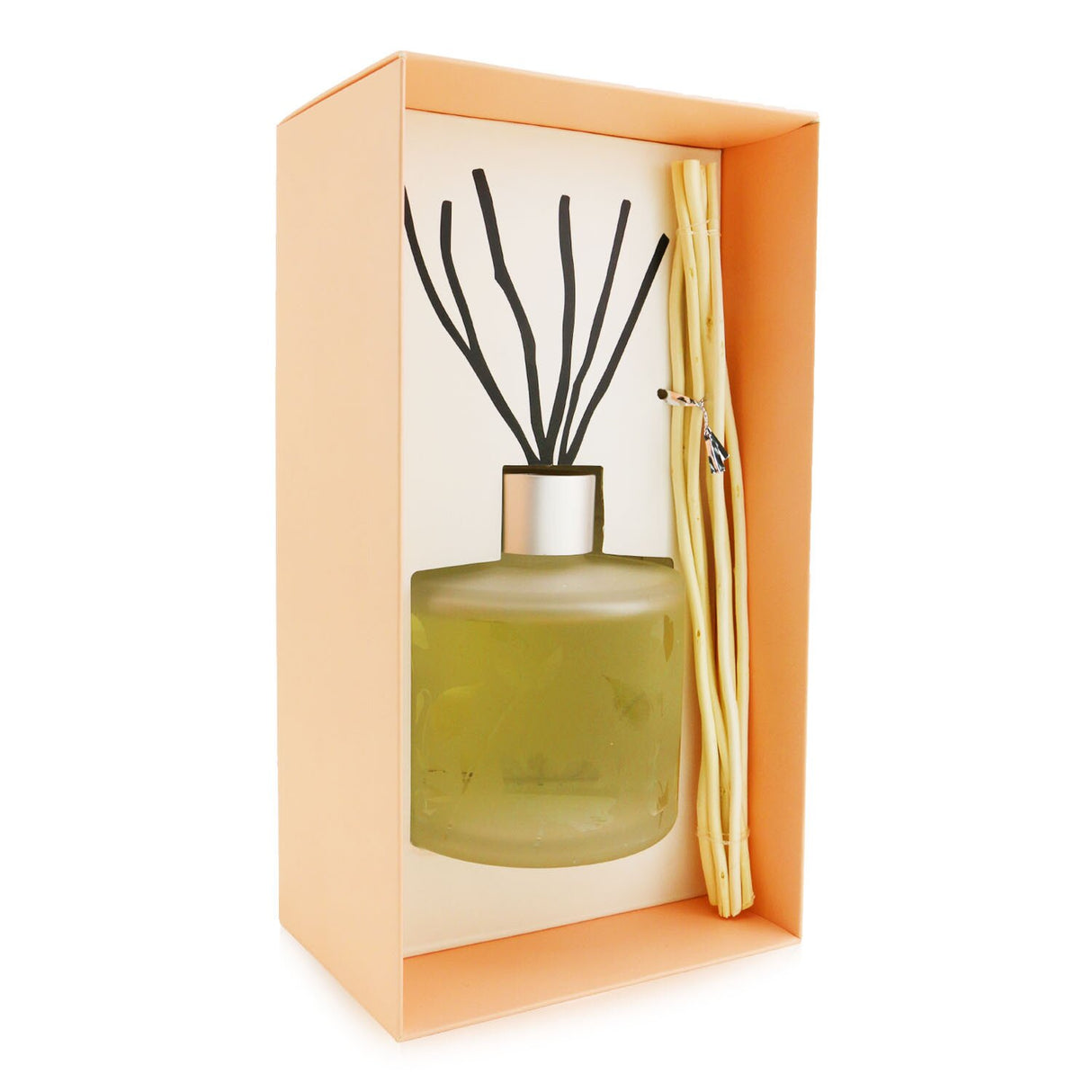 Frosted glass diffuser featuring ylang-ylang and patchouli scents, with natural willow stems for 6-8 weeks of fragrant ambiance.