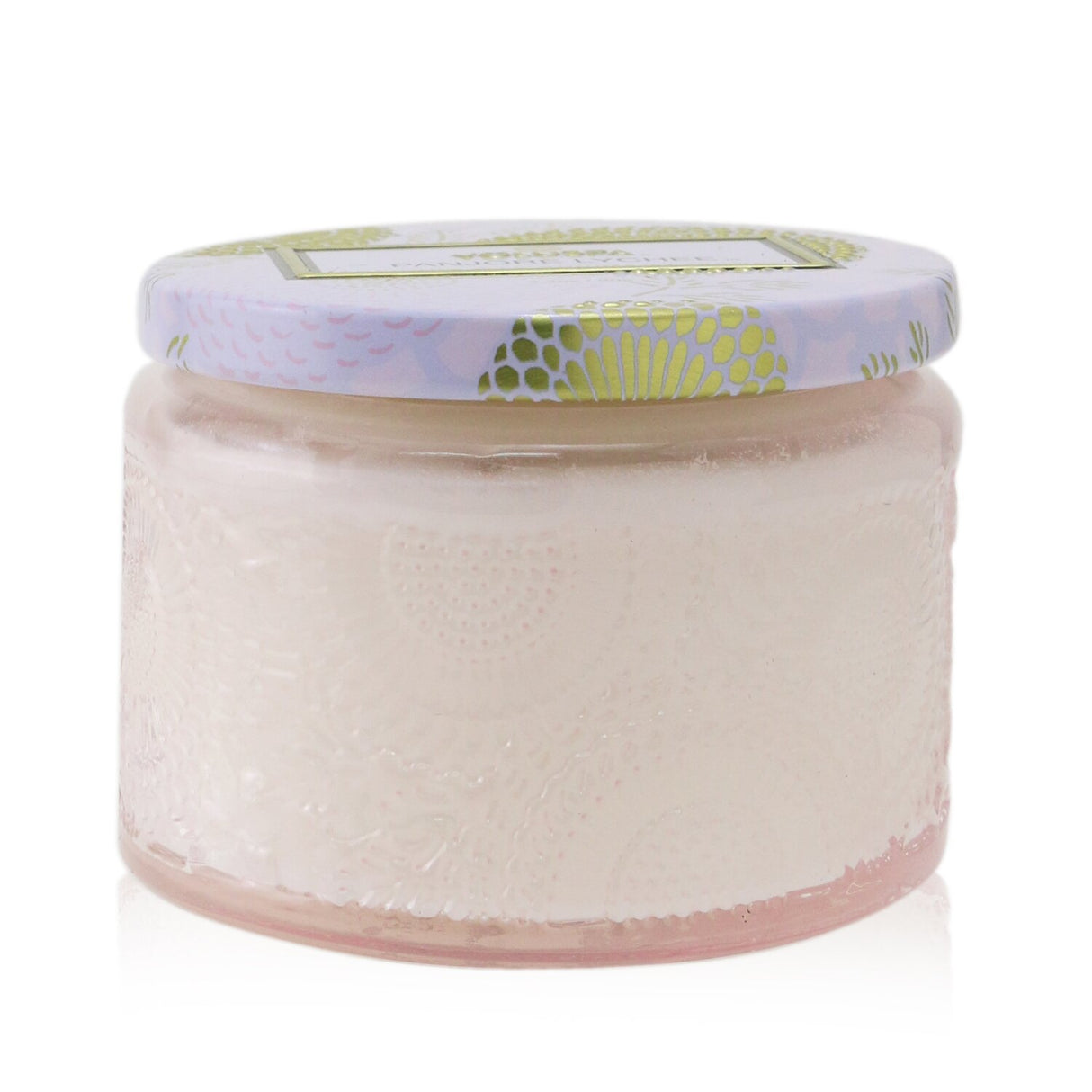 "Voluspa Panjore Lychee Petite Jar Candle features a vibrant container, tropical scent, and natural wax for a clean burn."