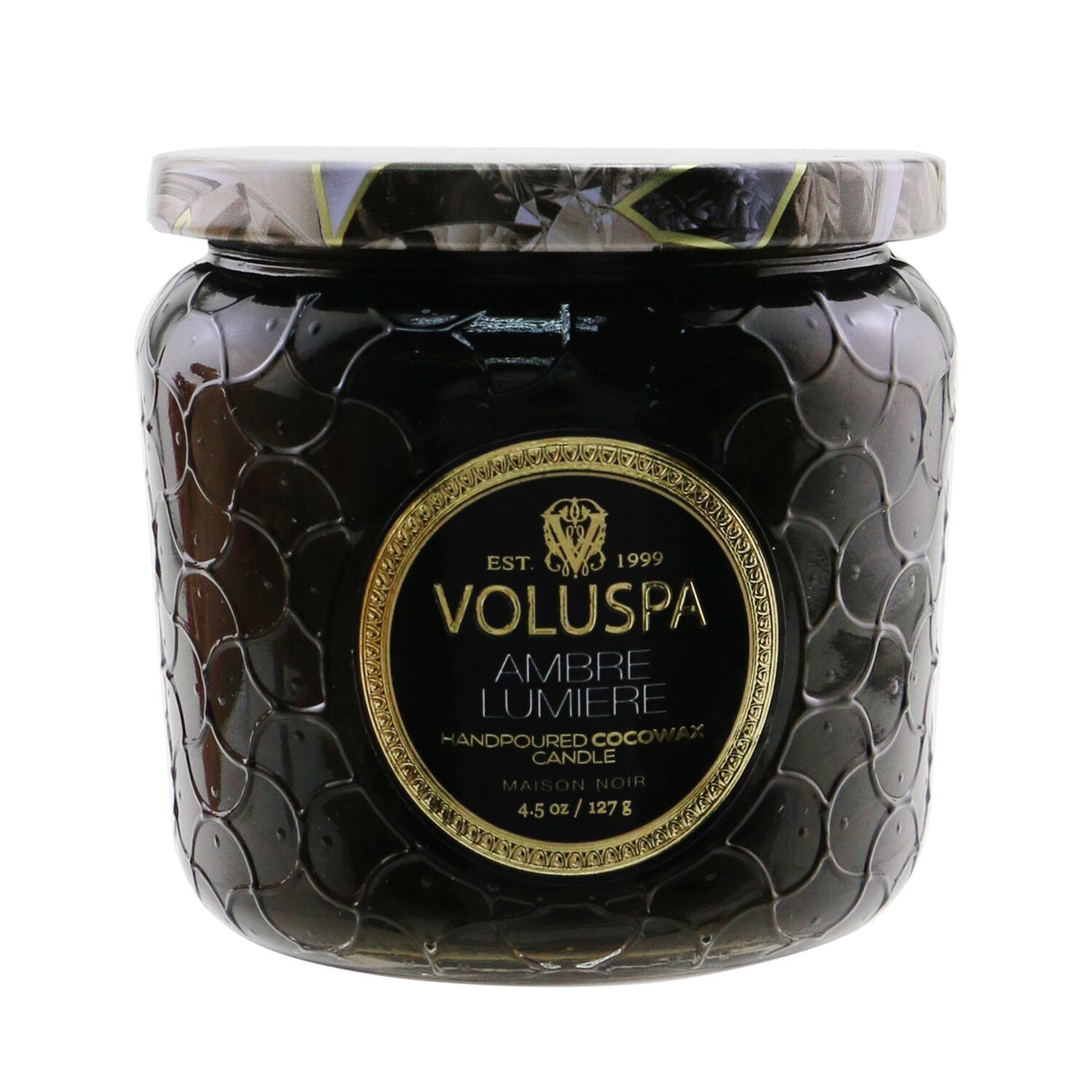 Voluspa Petite Jar Candle in Ambre Lumiere, 127g, in an embossed glass container with enchanting, long-lasting fragrance.