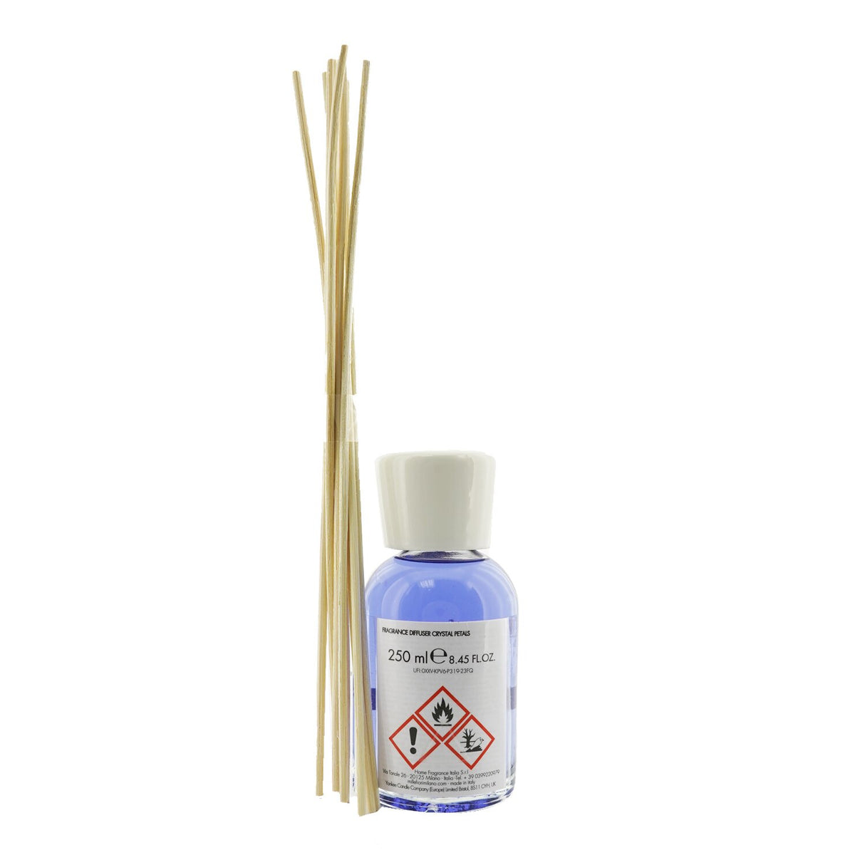 Elegant glass bottle of Millefiori Crystal Petals diffuser with dark wooden sticks, delivering a natural, refreshing scent.