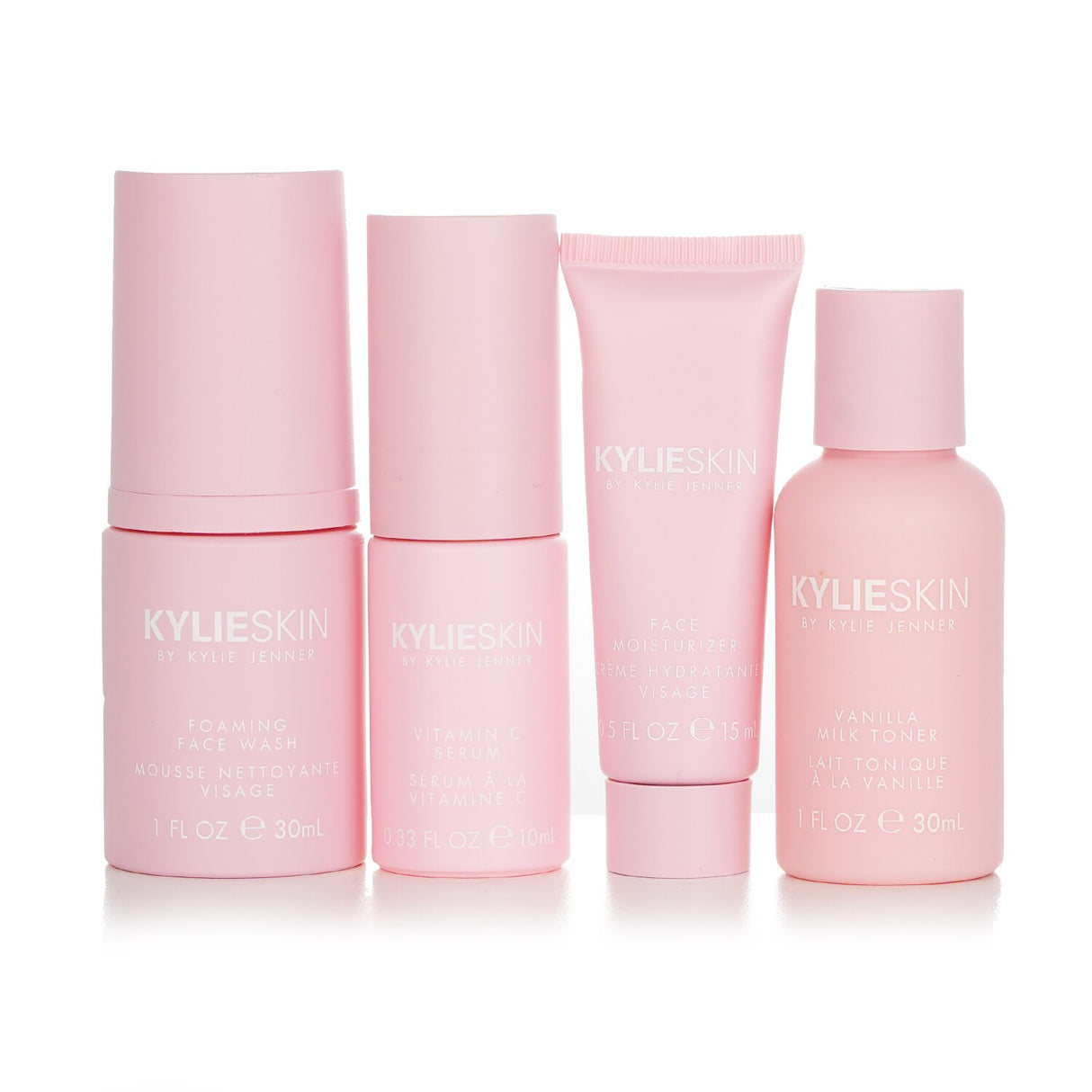Kylie Skin 4-Piece Mini Set featuring Foaming Face Wash, Moisturizer, Vitamin C Serum, and Vanilla Milk Toner for radiant skin.