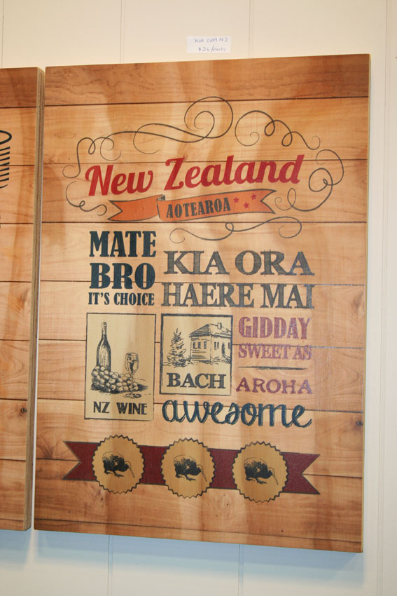 Kia Ora NZ Plywood wall art showcasing Kiwi culture, handcrafted from 18mm plywood, 293x420mm, perfect for home decor.