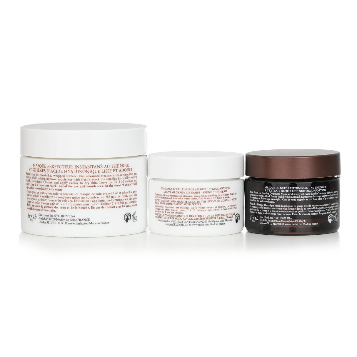 Skincare set featuring Sugar Face Polish, Black Tea Instant Mask, and Firming Overnight Mask for radiant, youthful skin.