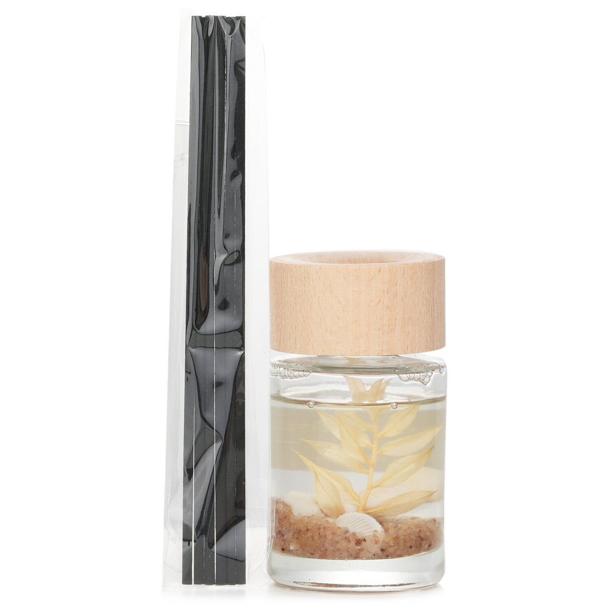 Botanica Sleep Ocean reed diffuser in transparent bottle with wooden lid, promoting relaxation with soothing scents.