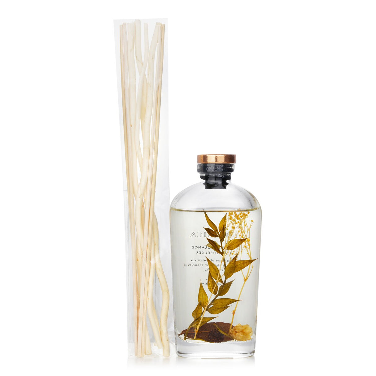 Botanica Herbal Reed Diffuser in transparent bottle with botanicals, offering calming scents and artistic decor.