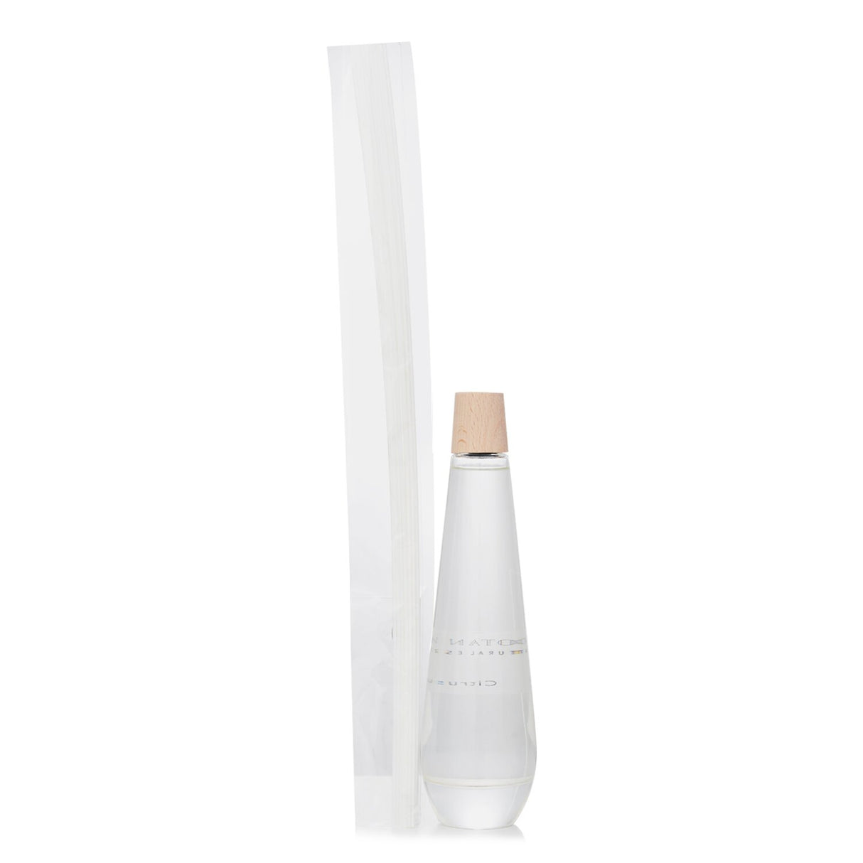 Botanica Shizen reed diffuser in an elegant pyramid bottle, featuring uplifting citrus scents for a refreshing home ambiance.