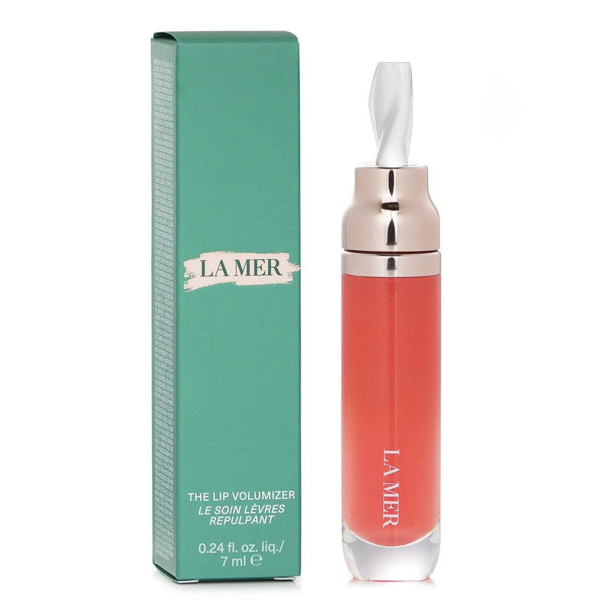 Luxurious La Mer Lip Volumizer in Sheer Coral, featuring serum technology for hydration, plumpness, and antioxidant protection.