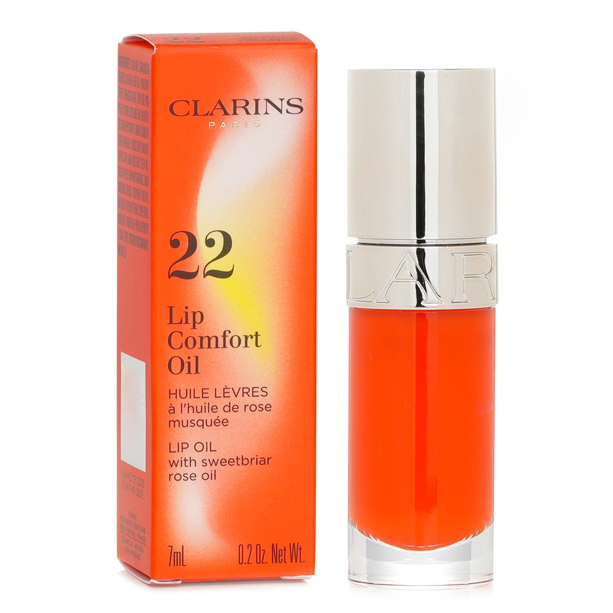 Nourishing lip oil in vibrant Daring Orange, enriched with Sweetbriar Rose Oil for hydration and shine.