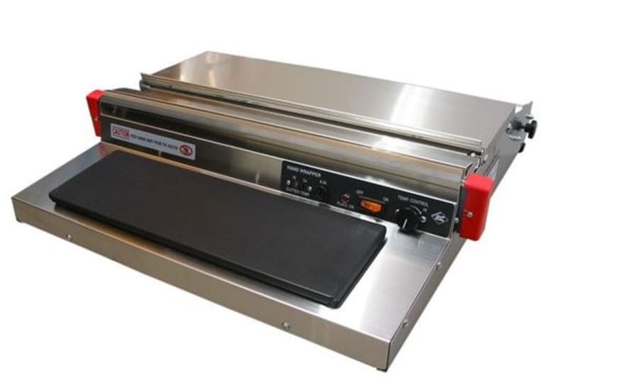 Electric stretch wrapper with stainless steel body, heat blade, and heated Teflon plate for preserving and presenting food safely.