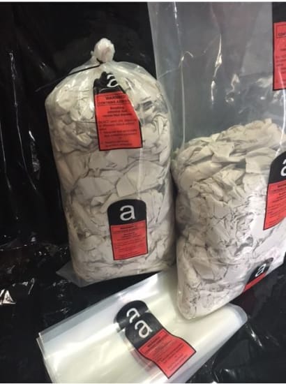 Clear asbestos disposal bags, 200MU thick, 600x1200mm, 75 bags per carton for safe hazardous material containment.