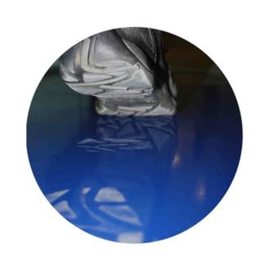 Blue sticky adhesive mat designed to capture dirt and dust from shoes, featuring 30 removable layers for easy cleaning.