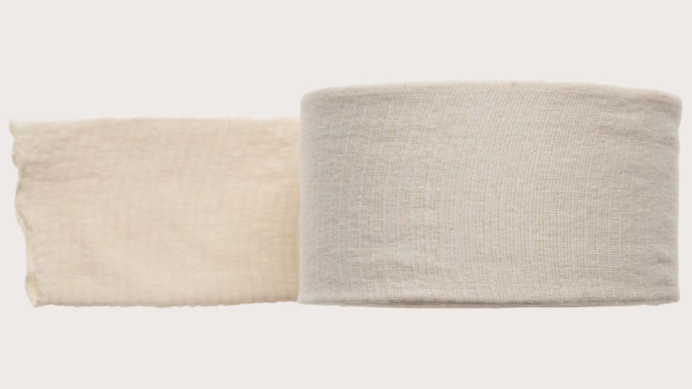 Tubigrip C Natural 10m tubular bandage for versatile support of injuries, strains, and comfortable healing solutions.
