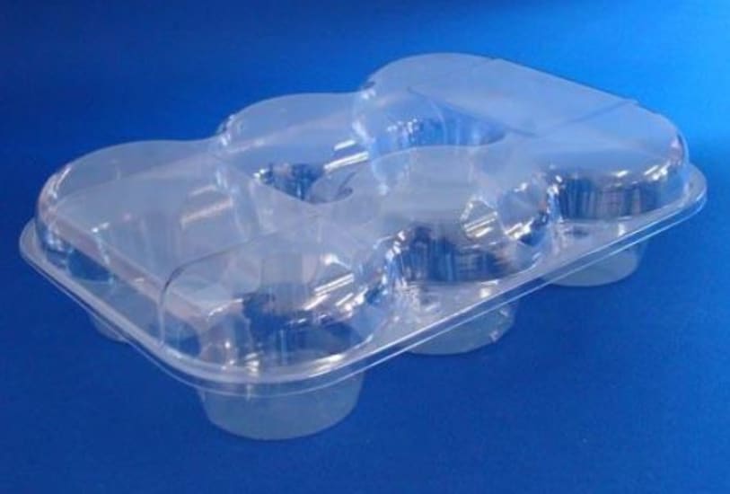 Clear 6 pack muffin clamshell container made from recyclable RPET, ideal for showcasing and securing baked goods.