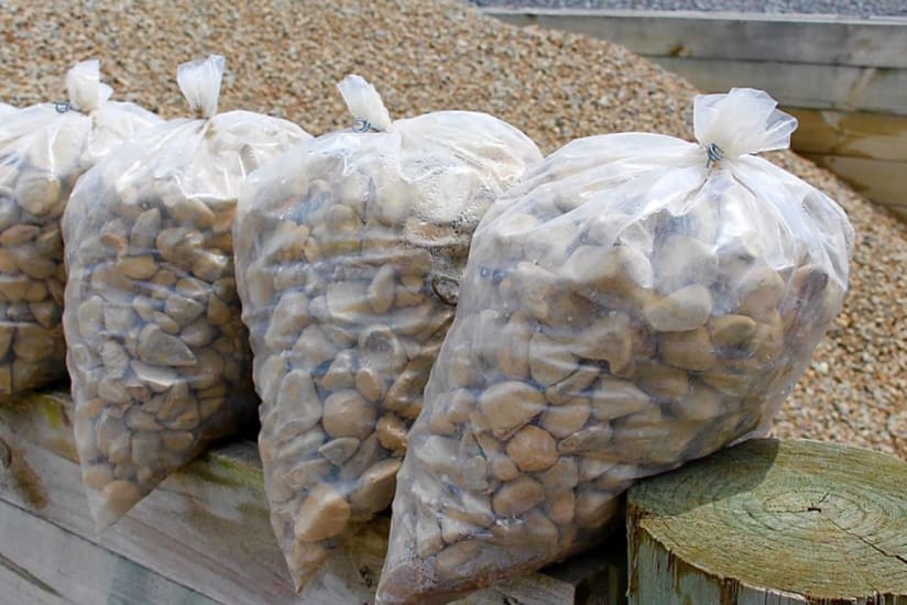 Heavy-duty clear plastic bags, 200 x 300mm, pack of 250, ideal for storage of food, firewood, and other heavy items.