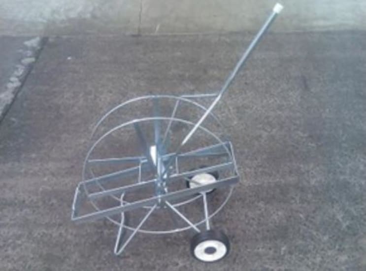 Dispenser for PP strapping with 150mm core, wheeled for mobility, ideal for efficient packaging and securing heavy loads.