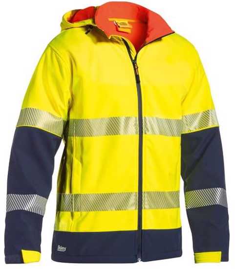 Hi-visibility yellow/navy soft shell jacket with reflective tape, showerproof, and warm fleece lining for outdoor safety.