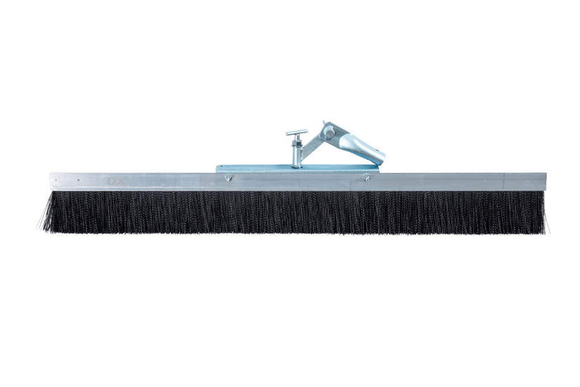 Professional-grade OX Concrete Finishing Broom-900mm with durable cast aluminium back and premium fibre bristles for efficient finishing.