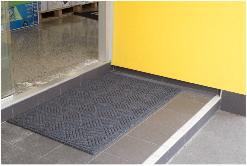 Heavy-duty eco-friendly scraper mat, 900x600mm, with raised nibs for effective dirt removal, ideal for outdoor entrances.