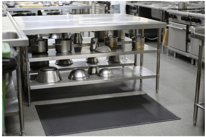 Black nitrile rubber mat measuring 880 x 620mm, featuring a hobnail texture for slip resistance and anti-fatigue benefits.