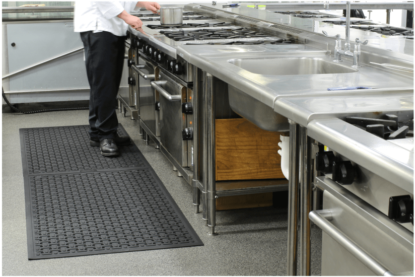 Kleen Thru Plus Mat in black, 1430 x 850 mm, featuring anti-slip surface, chemical resistance, and antibacterial properties for safety.