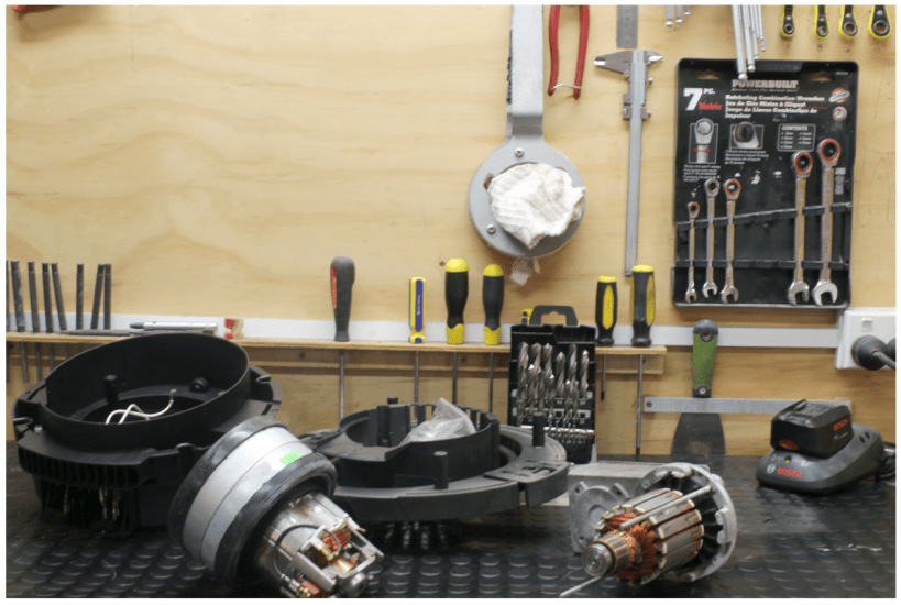 Durable black rubber flooring with round studs, 1200mm wide, slip-resistant, ideal for protecting tools and surfaces.