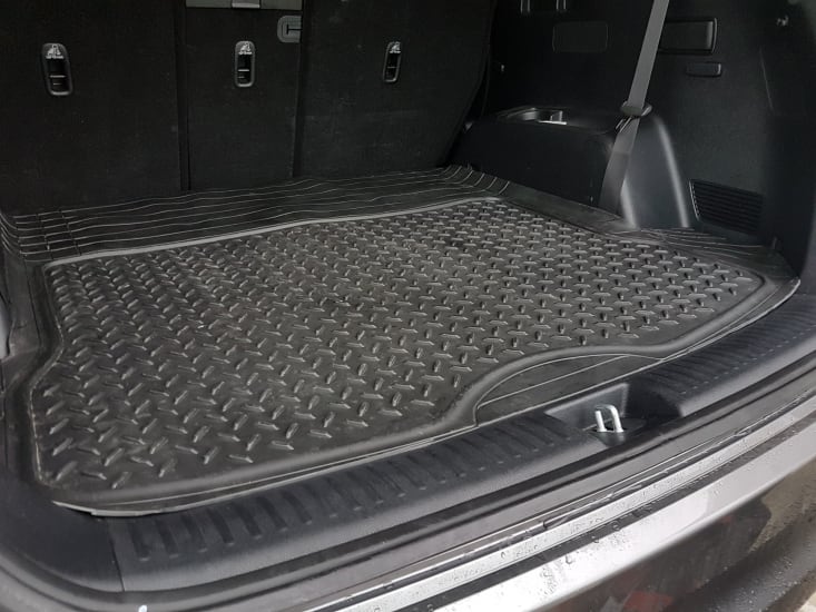 Robust PVC car boot mat (1400 x 1100mm) with a non-slip surface, checker pattern, and easy cleaning for SUVs.
