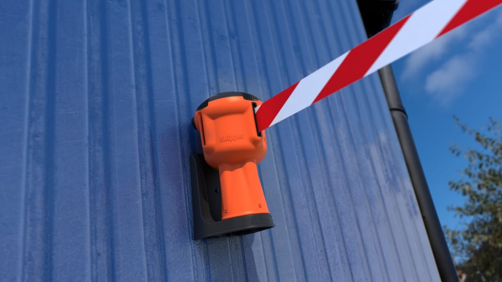 Magnetic support bracket for Skipper units, securely attaches to metal surfaces with soft pads to prevent scratches.