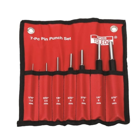 Heavy-duty Toledo 7-piece pin punch set with various sizes for precision pin removal in metalworking and woodworking.