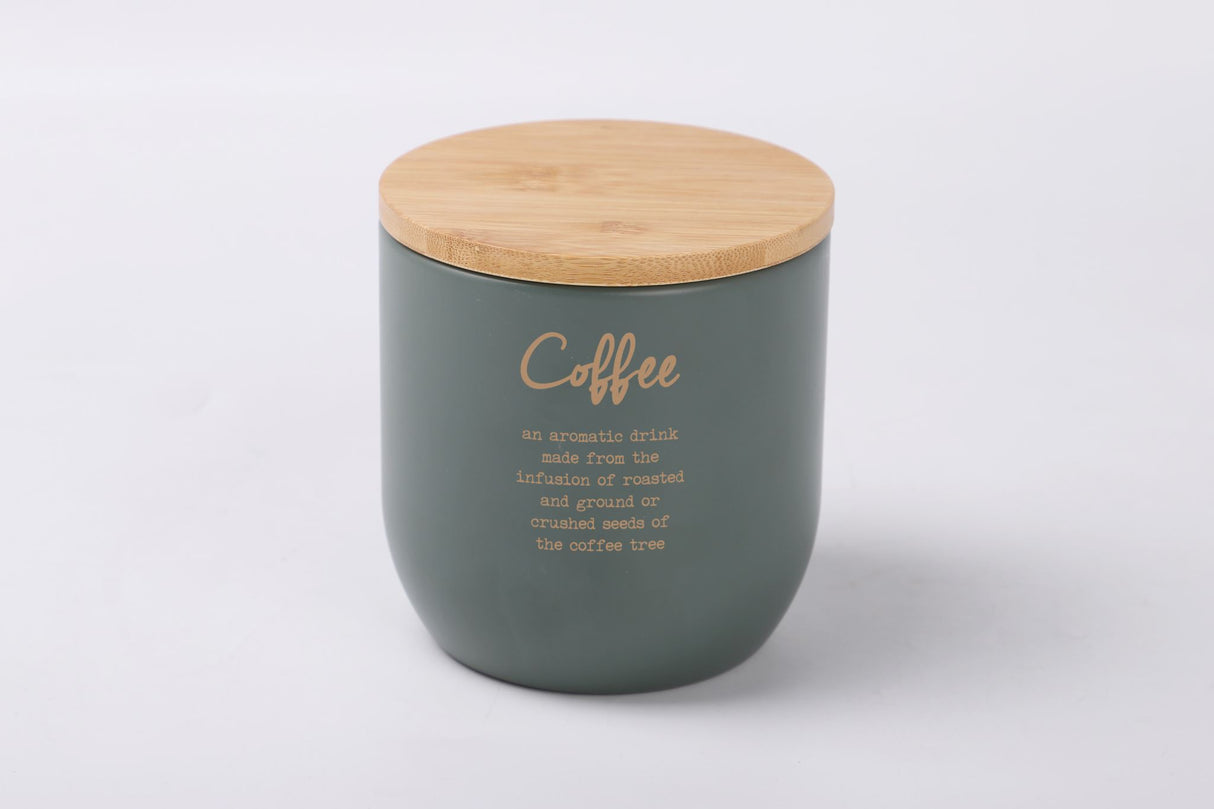Stylish gray-green metal coffee tin with gold lettering, bamboo lid, and airtight seal for fresh coffee storage.