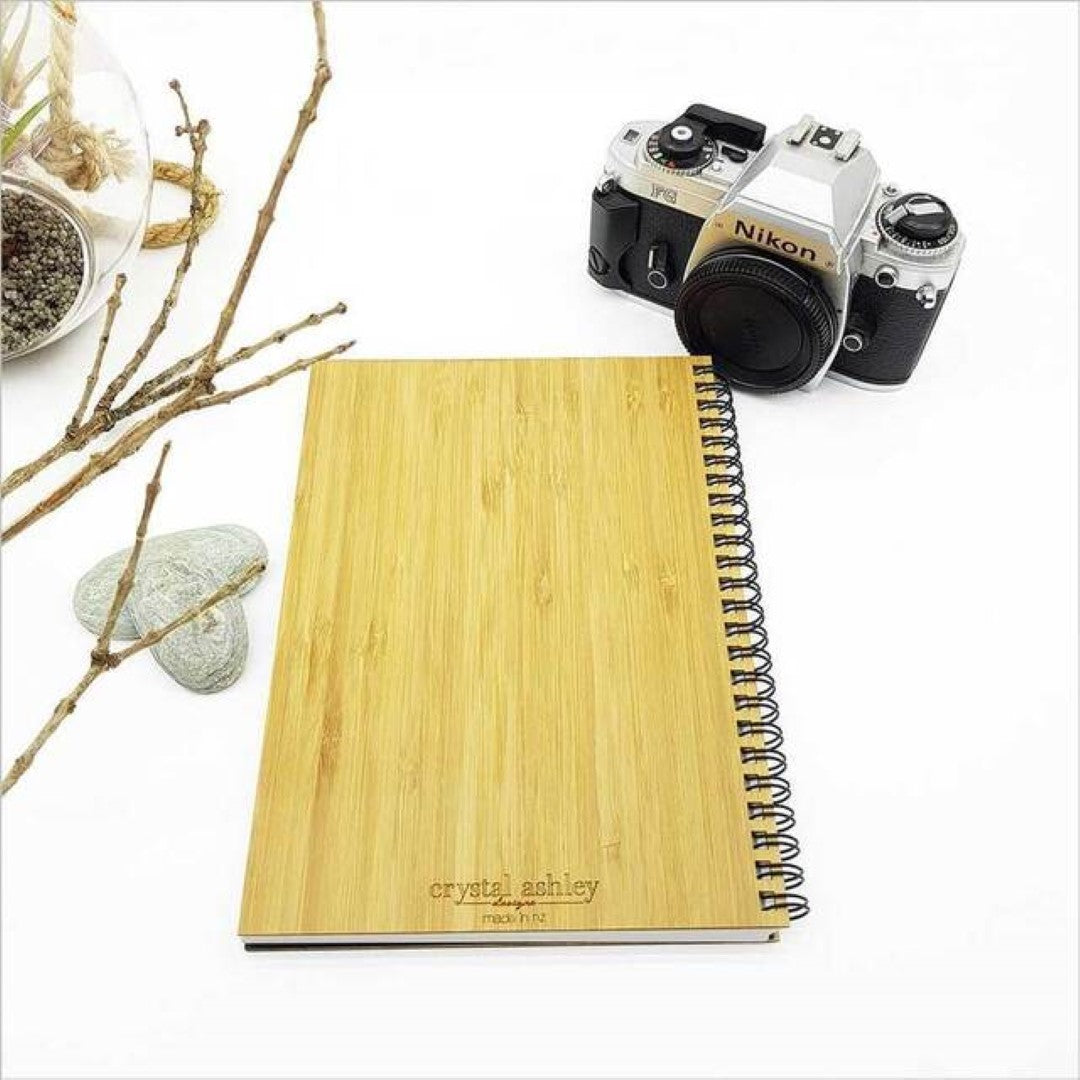Bamboo Journal with Ruru River Rimu motif, 160mm x 210mm, 110 pages of eco-friendly cartridge paper for writing and sketching.