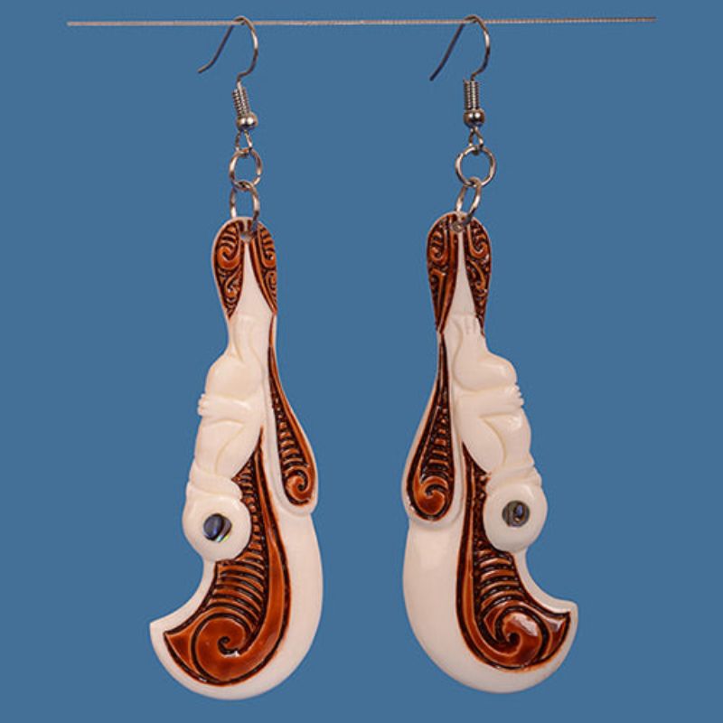 Bone Wahaika Earrings featuring a Tiki figure and Paua shell eye, showcasing M?ori artistry and cultural significance.