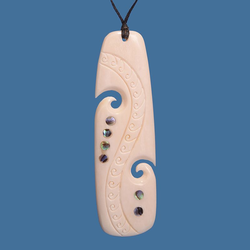 Elegant Bone Drop Pendant with unique Paua Shell inlay, measuring 85mm x 25mm, symbolizing new beginnings on a black cord.
