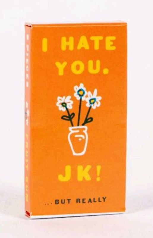 Chewy fruit-flavored gum packets with a playful "I Hate You...JK But Really" design, perfect for gifting and fun pranks.
