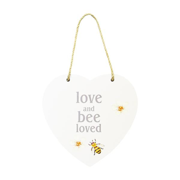 Heart-shaped MDF wall art with twine hanger, featuring "Love, and Bee Loved" inscription, 15 x 15 cm.
