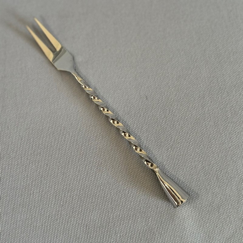 Twil Cocktail Fork (14cm) in stainless steel, perfect for serving appetizers and garnishes with style and elegance.