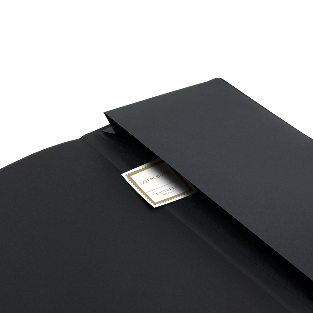 Elegant Castelli Oro Notebook with textured geometric design, ruled ivory pages, gold ribbon marker, and document pocket.
