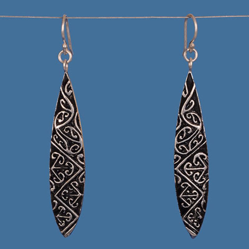 Silver plated Maori design earrings, handcrafted from brass, showcasing intricate patterns and cultural heritage, perfect for any occasion.