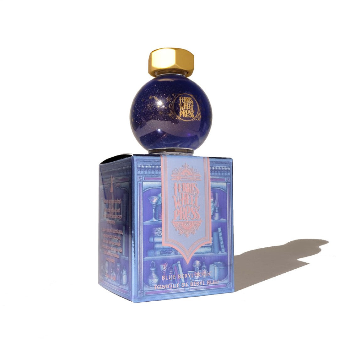 Ferris Wheel Press Ferritales Blue Beryl Tonic ink in a 20ml glass bottle, featuring periwinkle blue and rose gold shimmer.