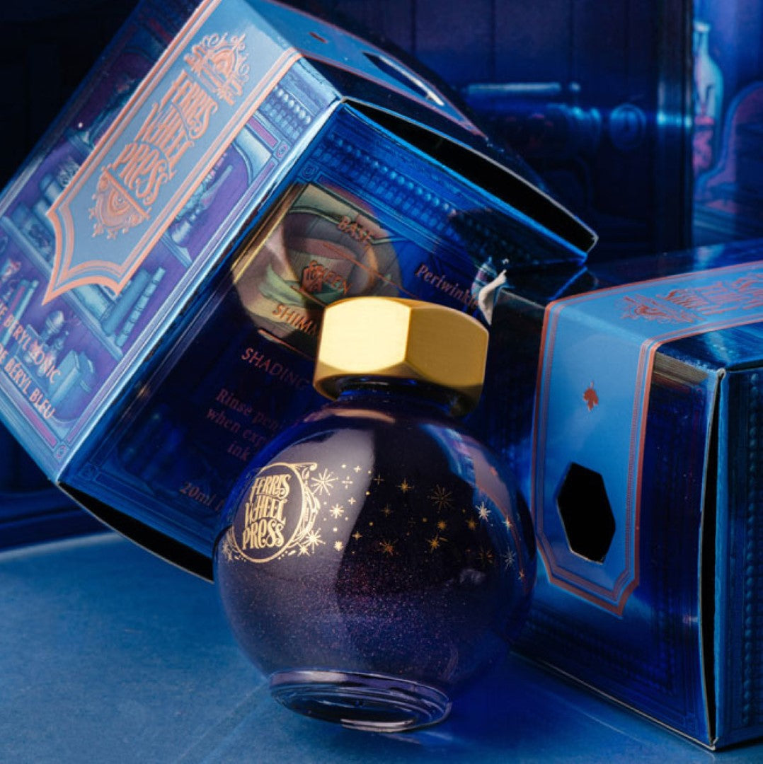 Ferris Wheel Press Ferritales Blue Beryl Tonic ink in a 20ml bottle, featuring periwinkle blue, purple sheen, and rose gold shimmer.