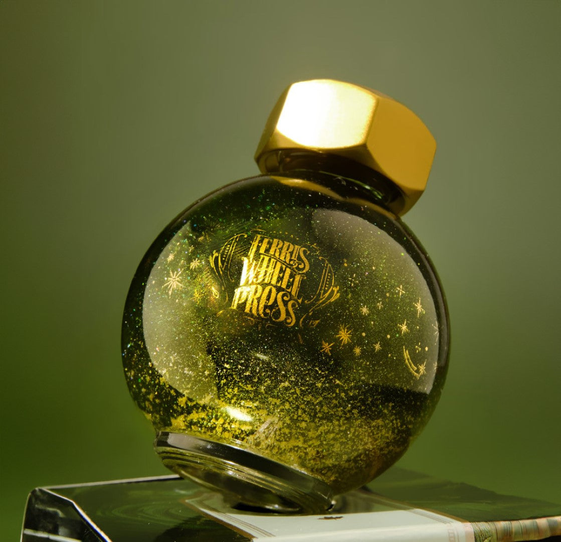 Light green fountain pen ink with champagne shimmer in a 20ml glass bottle, designed to inspire creativity in writing.