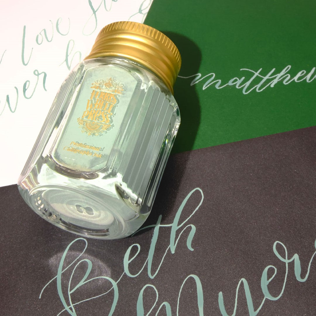 Sage green calligraphy ink in a 28ml bottle, ideal for elegant writing and artistic projects.