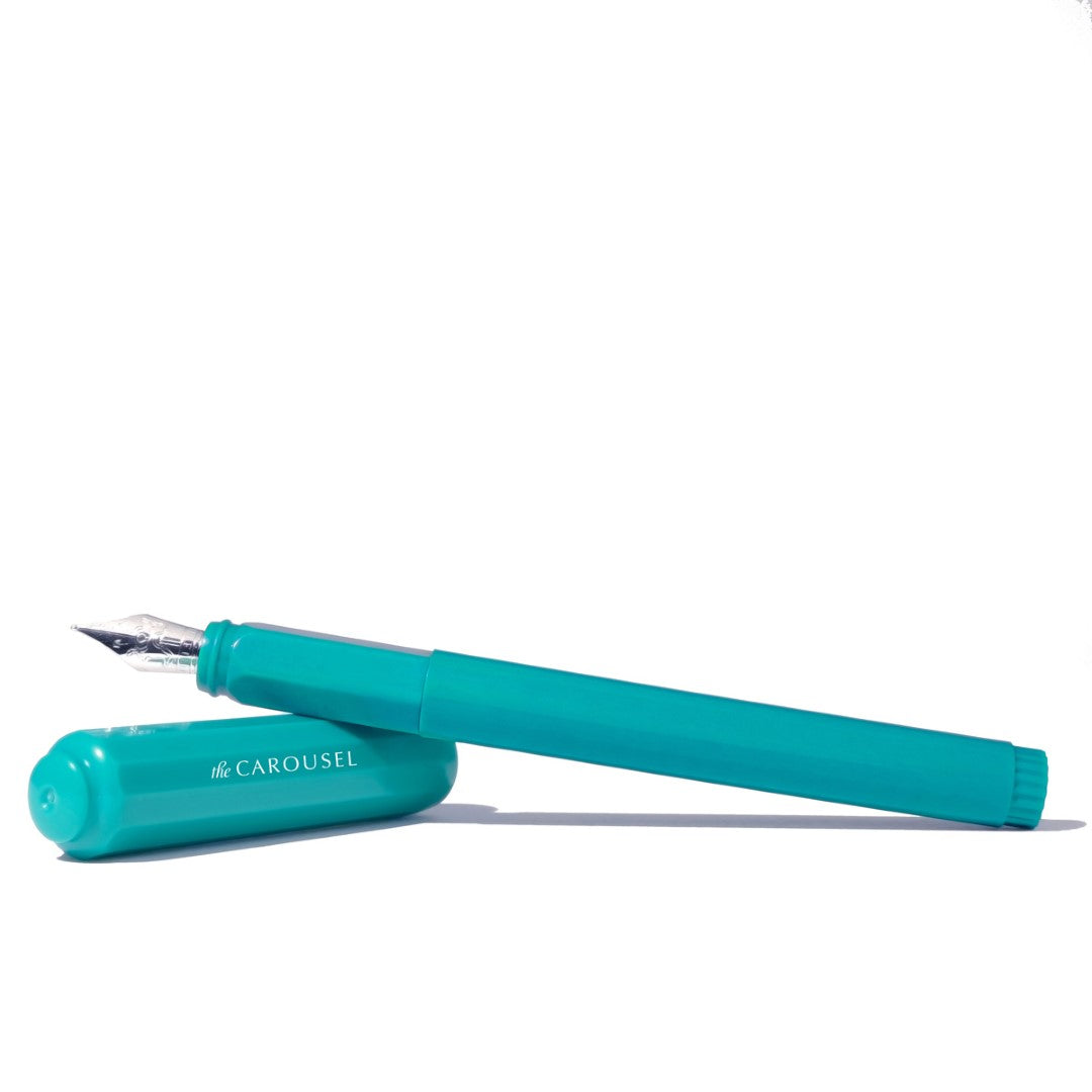 Ferris Wheel Press Carousel fountain pen in Tumultuous Tides, featuring a galloping horse motif, custom steel nib, and vibrant design.