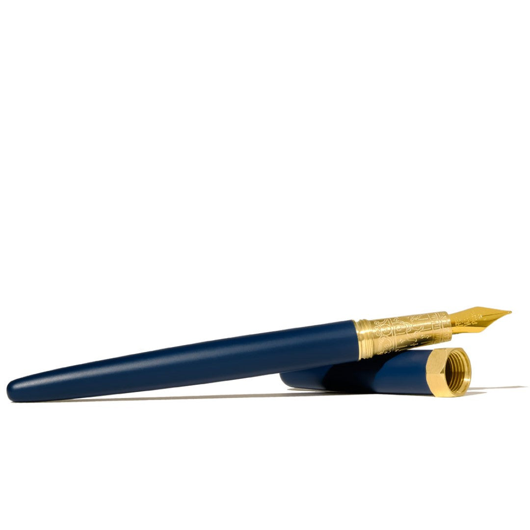 Ferris Wheel Press Fountain Pen in Crystal Blue with 14k gold nib, showcasing luxurious satin finish and engraved brass grip.