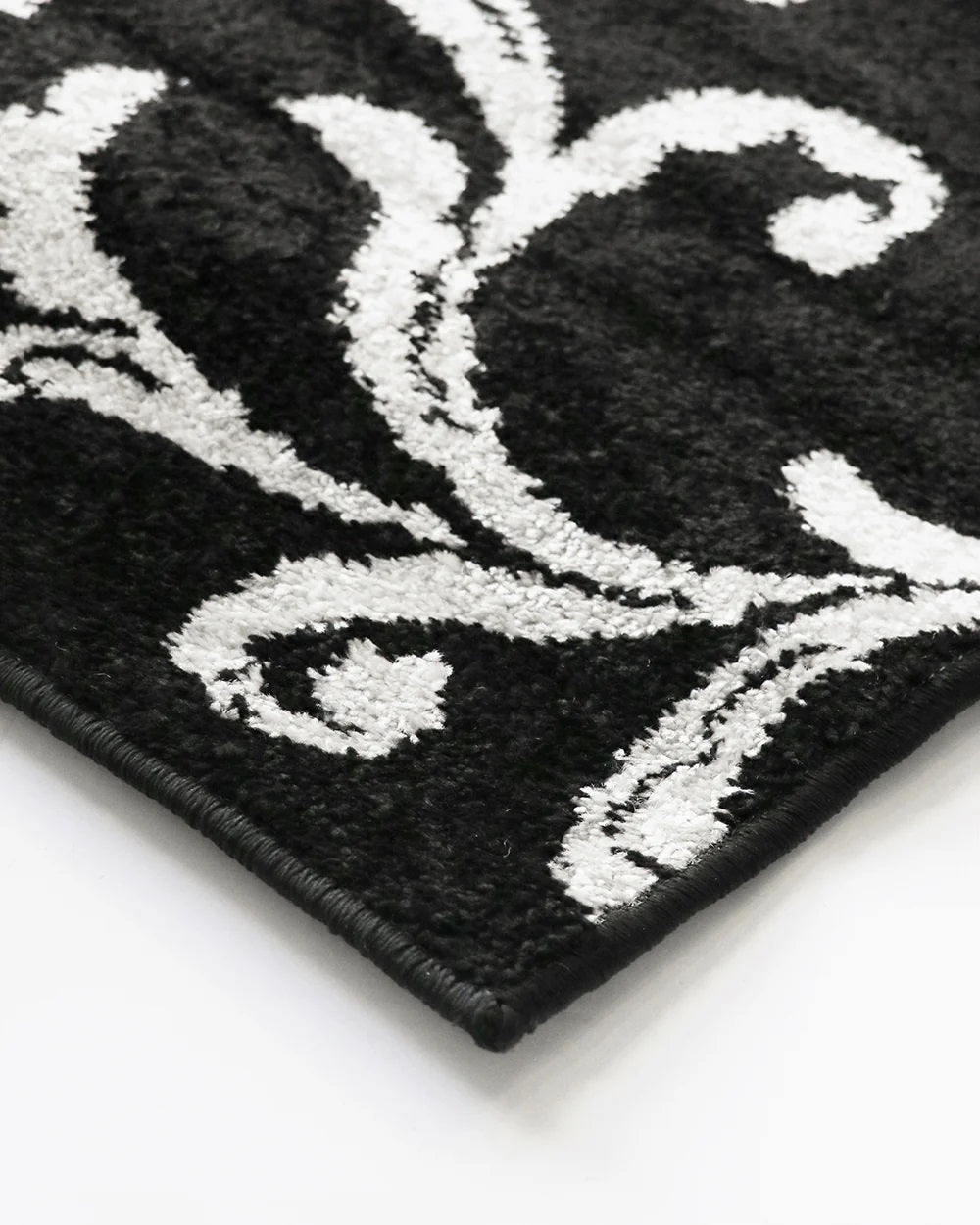 Stylish black and grey multi-pattern floor rug, 160x235cm, crafted from soft heatset polypropylene for durability and luxury.